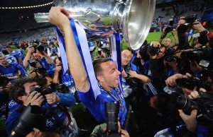 MUNICH, GERMANY - MAY 19: John Terry of Chelsea celebrates with the trophy after their victory in the UEFA Champions League Final between FC Bayern Muenchen and Chelsea at the Fussball Arena München on May 19, 2012 in Munich, Germany. (Photo by Lars Baron/Bongarts/Getty Images)